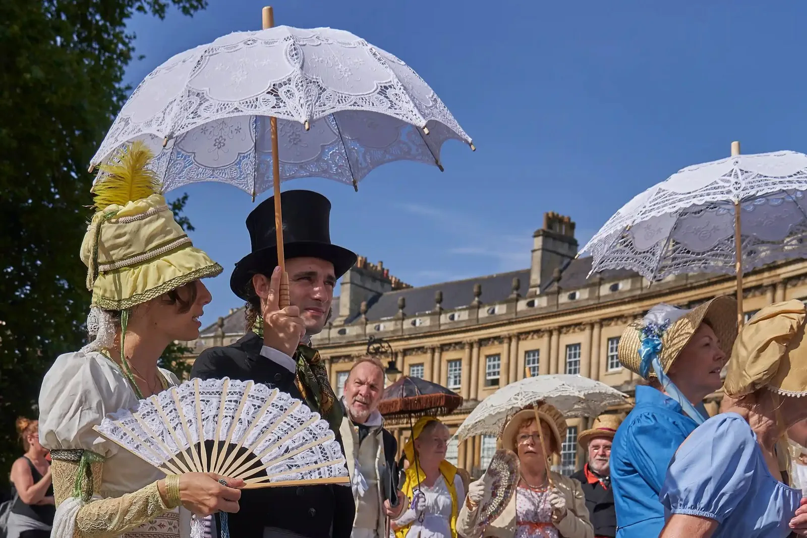 Parade of people dressed in period costume from the Georgian era as part of the annual Jane Austen festival in Bath