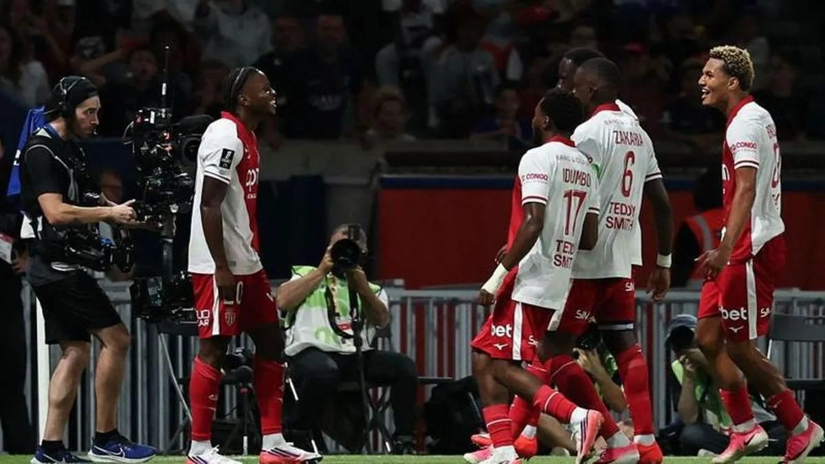 Monaco players celebrate scoring against PSG