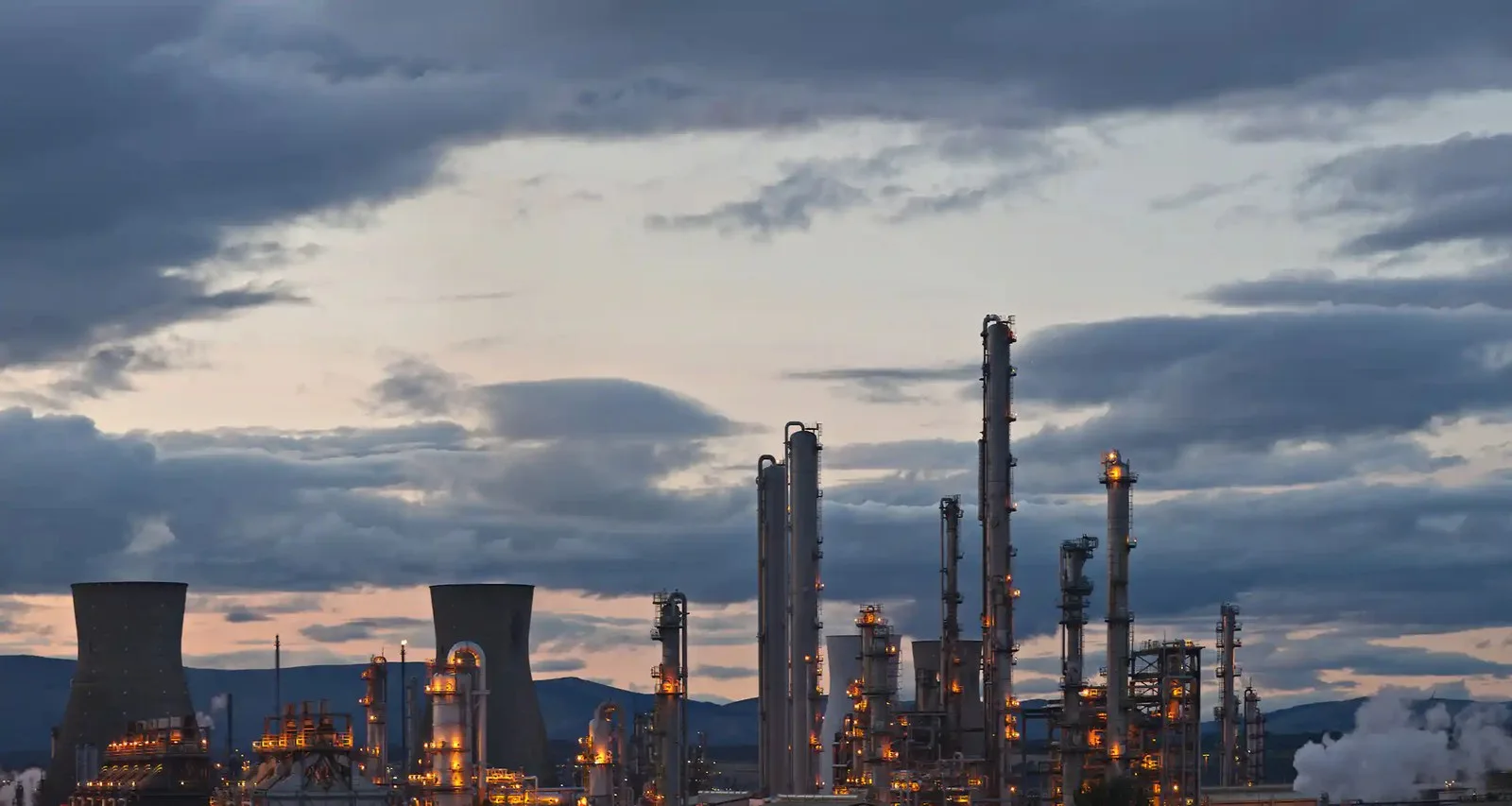 oil refinery, silhouette, cloudy sky