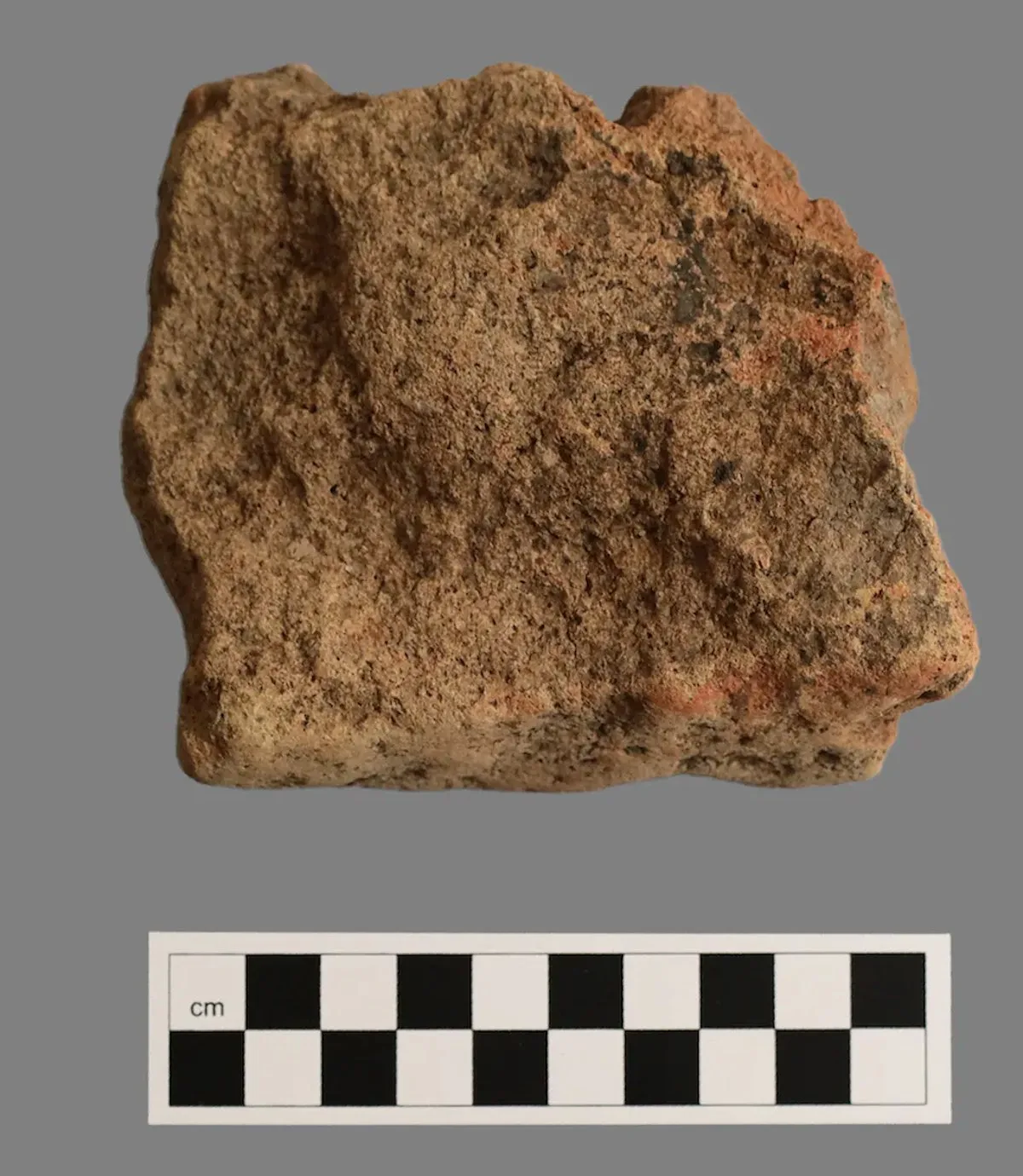 A piece of Roman tile, excavated from the headquarters building.