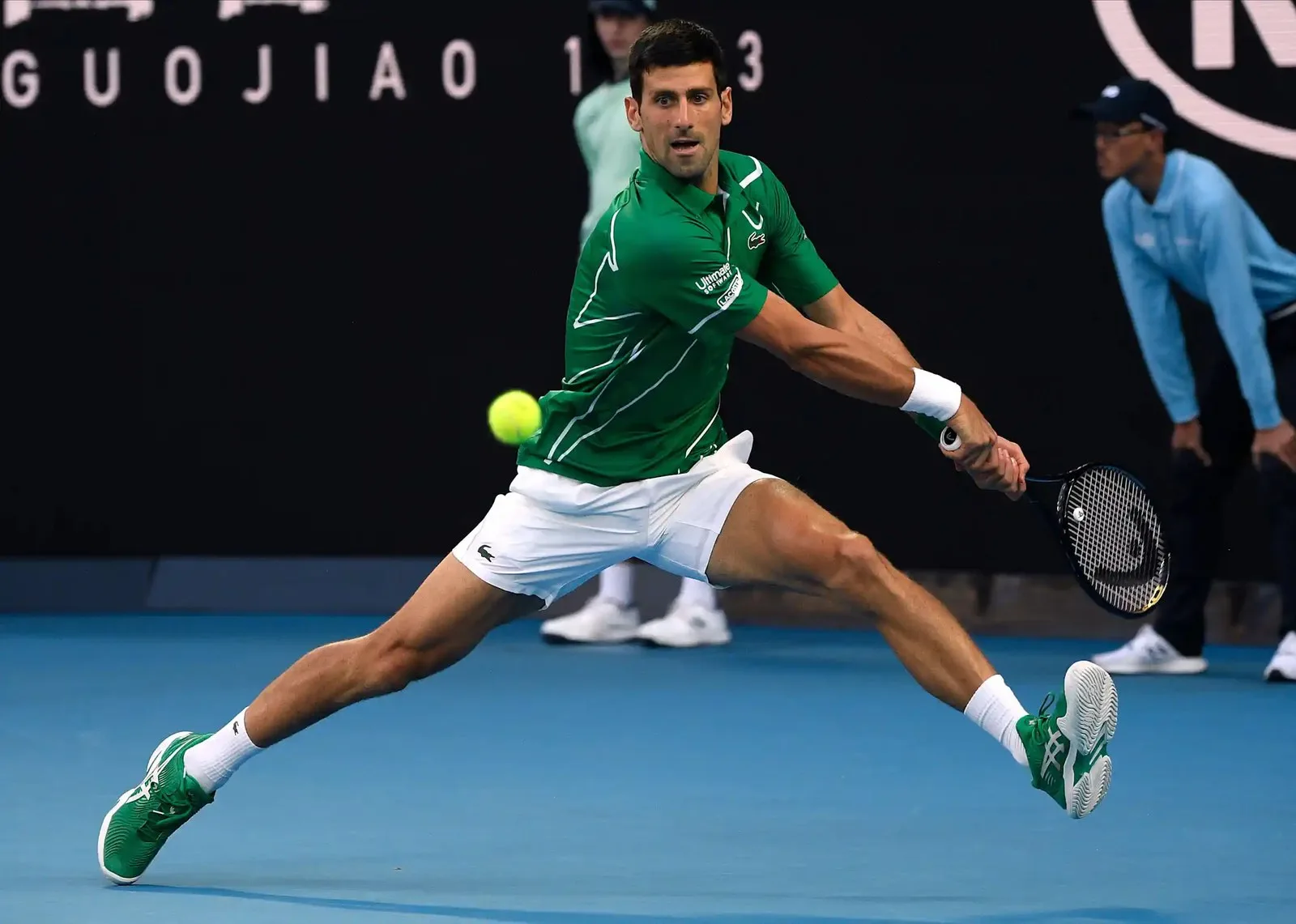 Novak Djokovic making a backhand return.