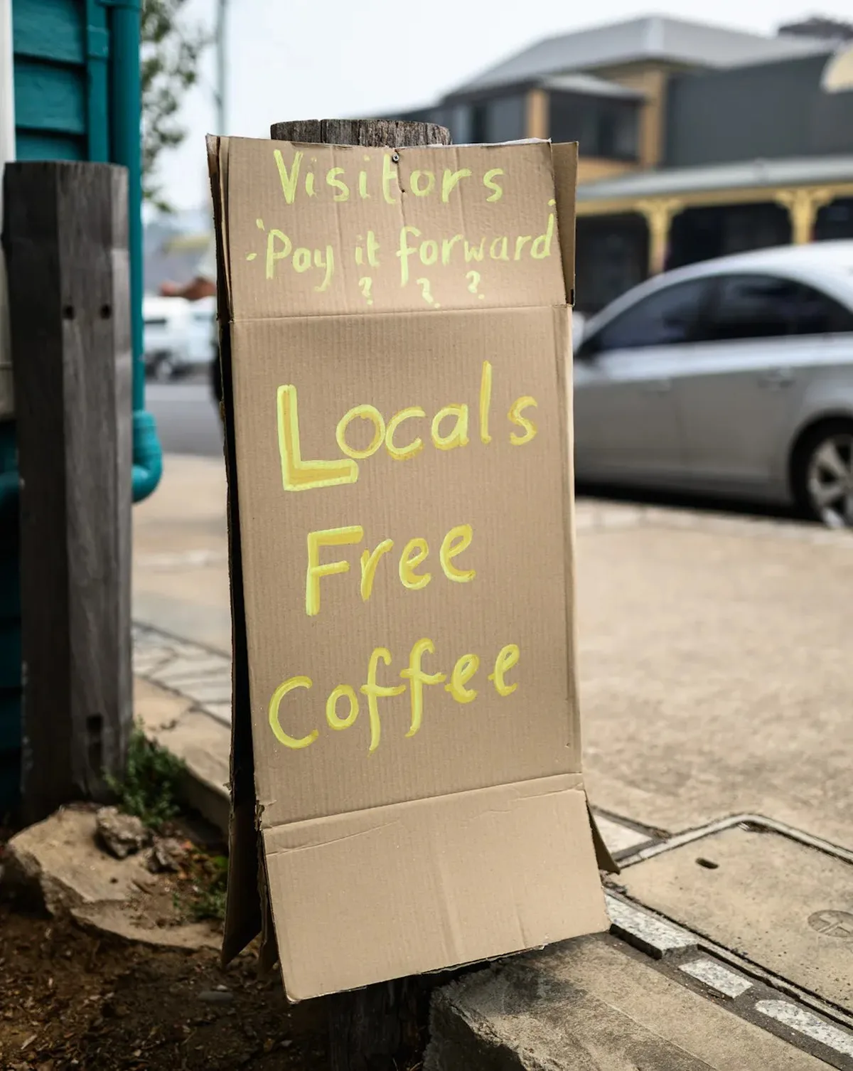 A sign offering free coffee for locals on the main street of Cobargo.