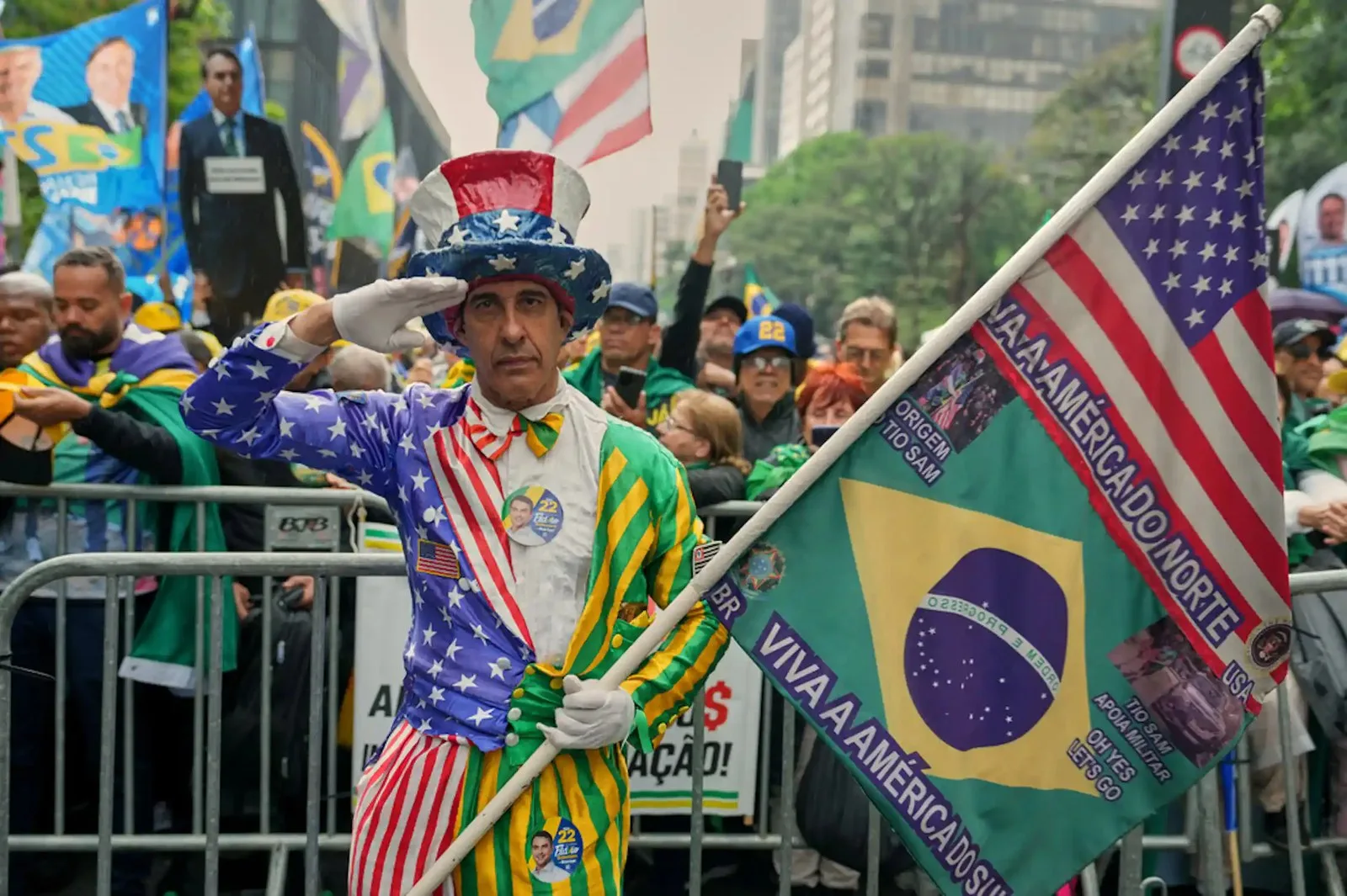 A demonstrator in a costume holds two flags.