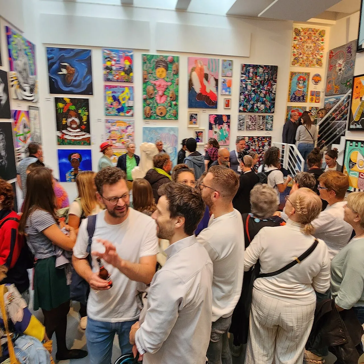 Visitors interacting with the artworks and each other during exhibition