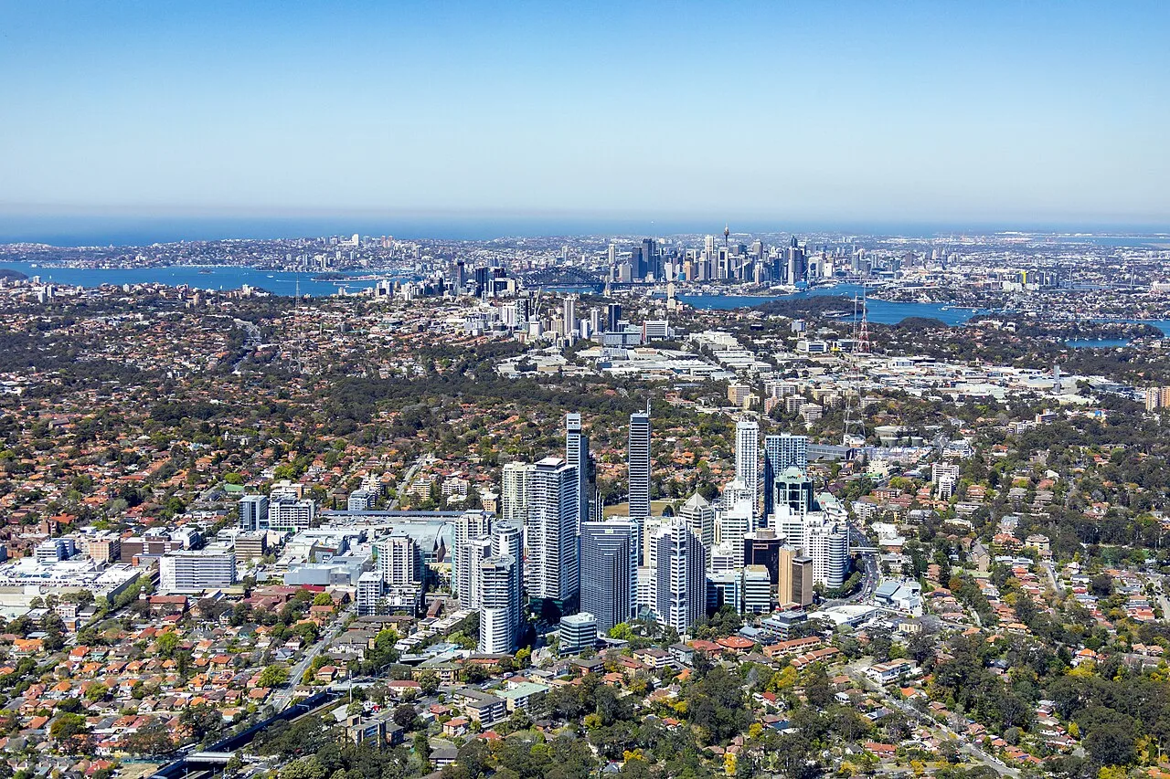 Aerial view of Chatswood, Australia, looking towards Sydney. The boundaries between low density residential, commercial and industrial zones are clearly visible.